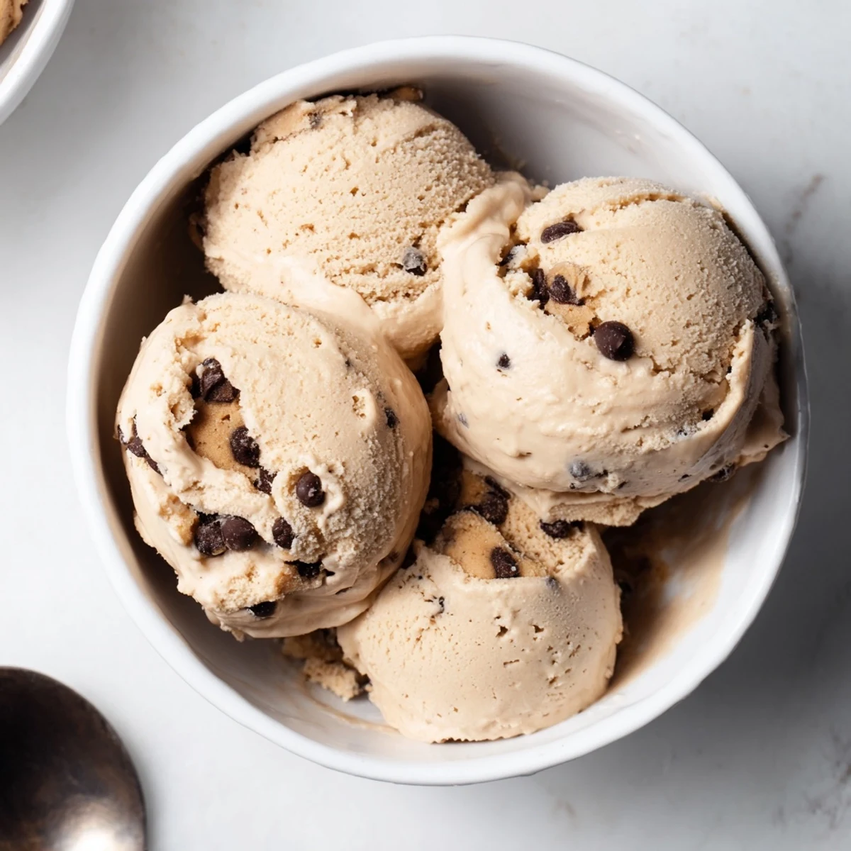 Creamy cottage cheese ice cream adorned with rich cookie dough bites.  