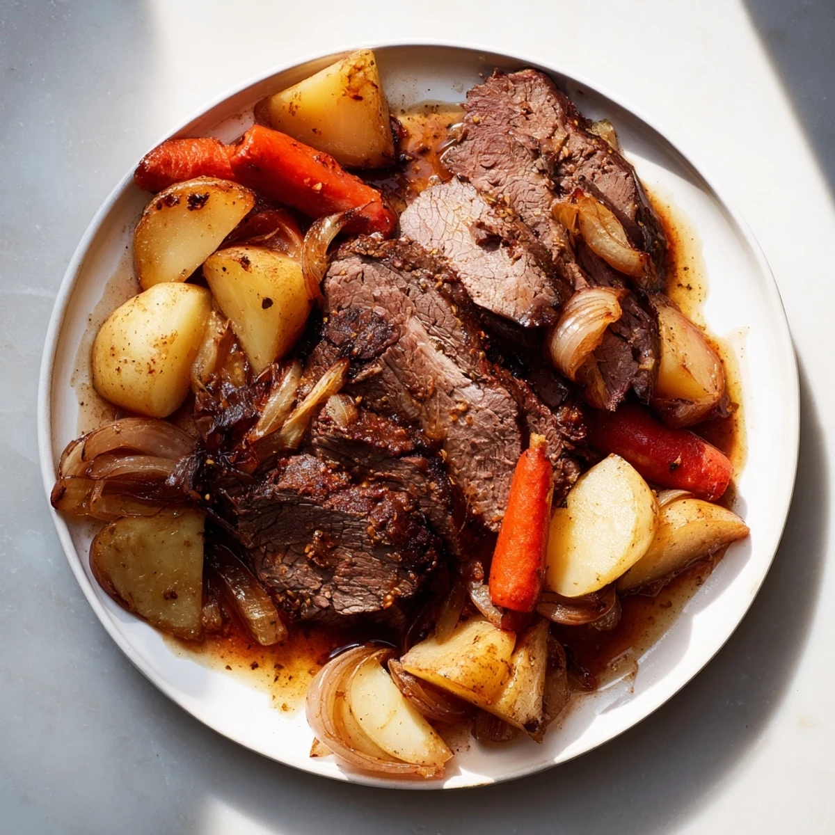 A steaming plate of Sunday Pot Roast, featuring juicy beef and tender, caramelized root vegetables.