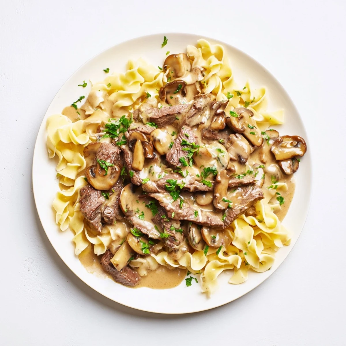 Creamy Mushroom Beef Stroganoff with rich, brown beef and mushrooms in a luscious, creamy sauce.