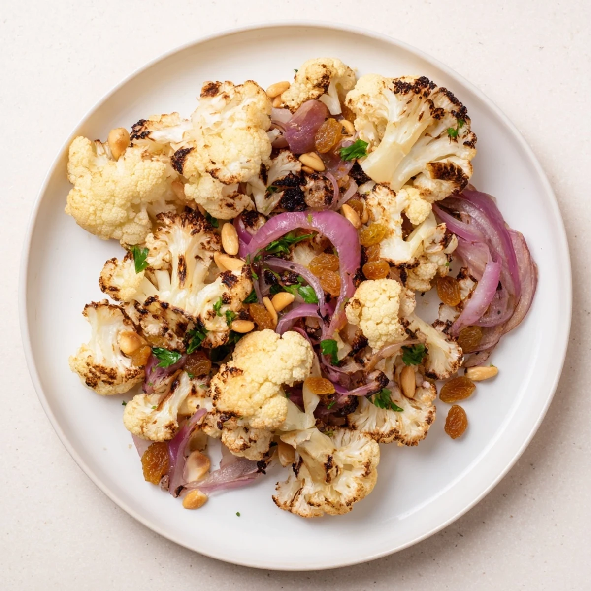 Golden-brown roasted cauliflower salad with lemon pine-nut dressing; a healthy Mediterranean lunch.