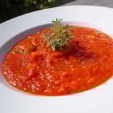 Smooth, blended veggie-loaded tomato pasta sauce with rich red color, ready to spoon over healthy pasta.