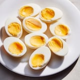 A close-up of Air Fryer Boiled Eggs, showing the creamy yolk, ready for deviled eggs or salads.