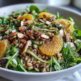 Tossed Farro Salad Bowl with crisp fennel, juicy oranges, and almonds, drizzled with zesty vinaigrette.