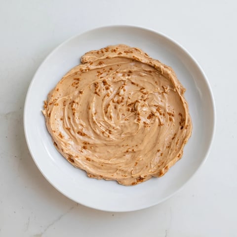 Creamy Quick Christmas Cookie Butter Spread, ready to be enjoyed with warm spices on toast.