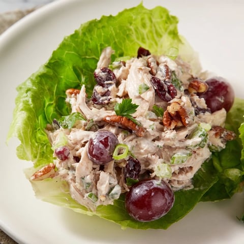 Festive Chicken Salad Cups, a colorful appetizer with juicy grapes and crunchy pecans, beautifully presented.