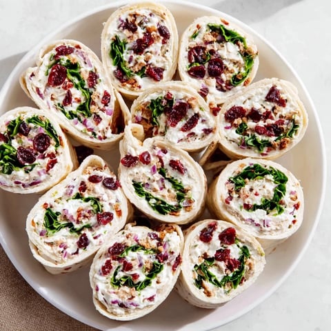 Vibrant photo of delicious turkey cranberry pinwheels, showcasing the flavorful appetizer ready to serve.