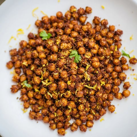 Golden, crispy Harissa Chickpea Roast, bursting with smoky spices, ready for a flavorful snack.