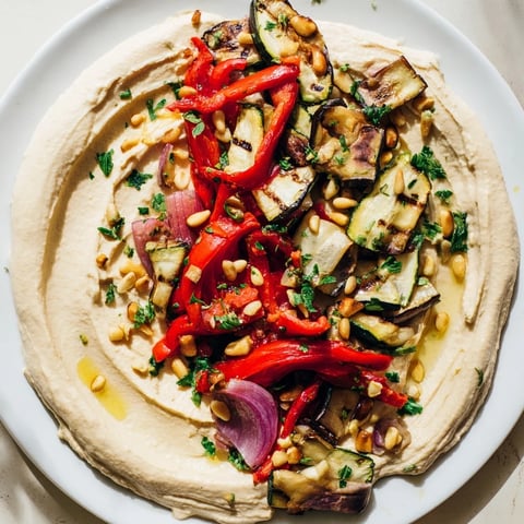 Vibrant Hummus Roasted Veggies, with beautifully charred veggies topping creamy hummus, ready to serve.