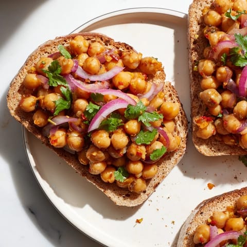 Golden toast piled high with juicy BBQ chickpeas, a delicious vegan lunch or dinner option.