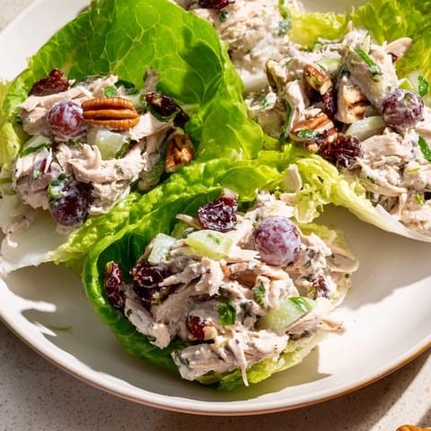 Vibrant Festive Chicken Salad Cups, filled with tender chicken, creamy dressing, and served in crisp lettuce.