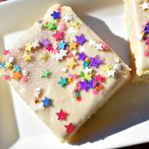 Golden, buttery Twinkle Twinkle Star Dessert Bars, frosted with creamy vanilla and sprinkled stars.