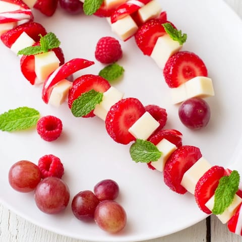 Vibrant Candy Cane Stripe Fruit and Cheese; a colorful, festive platter for holiday parties.