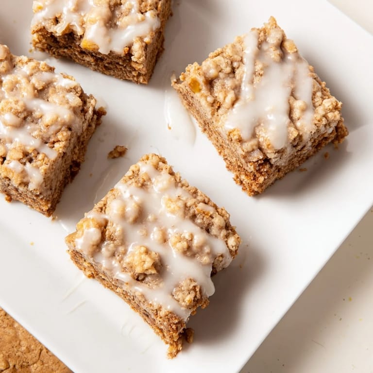 Sweet and aromatic, a close-up of delicious Lemon-Glazed Gingerbread Crumble Bars, ready to eat and enjoy.