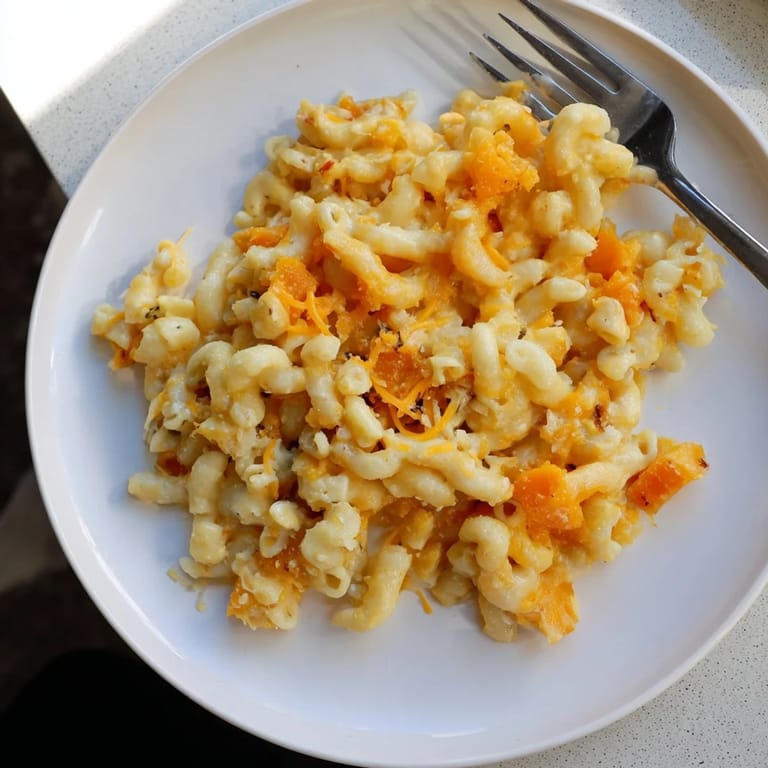 Golden, creamy One-Pot Butternut Squash Mac & Cheese, with a swirl of butternut squash.