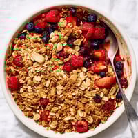 Warm Berry Oat Crumble with a sweet toasted almond topping, ready to serve.